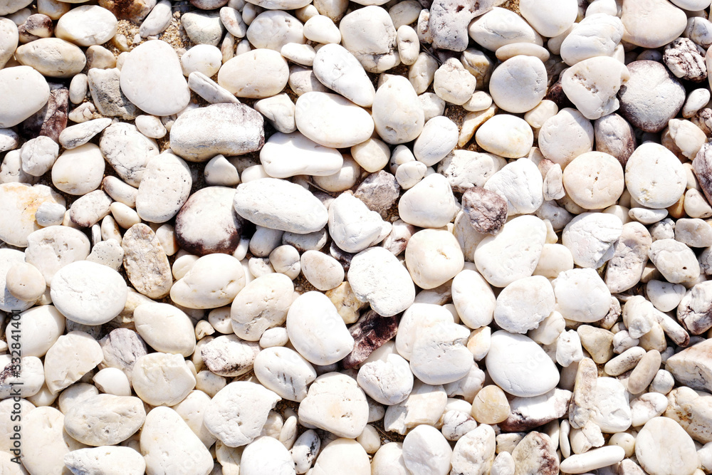 white pebbles on the beach background. white stone white pebbles on the beach background. white stone