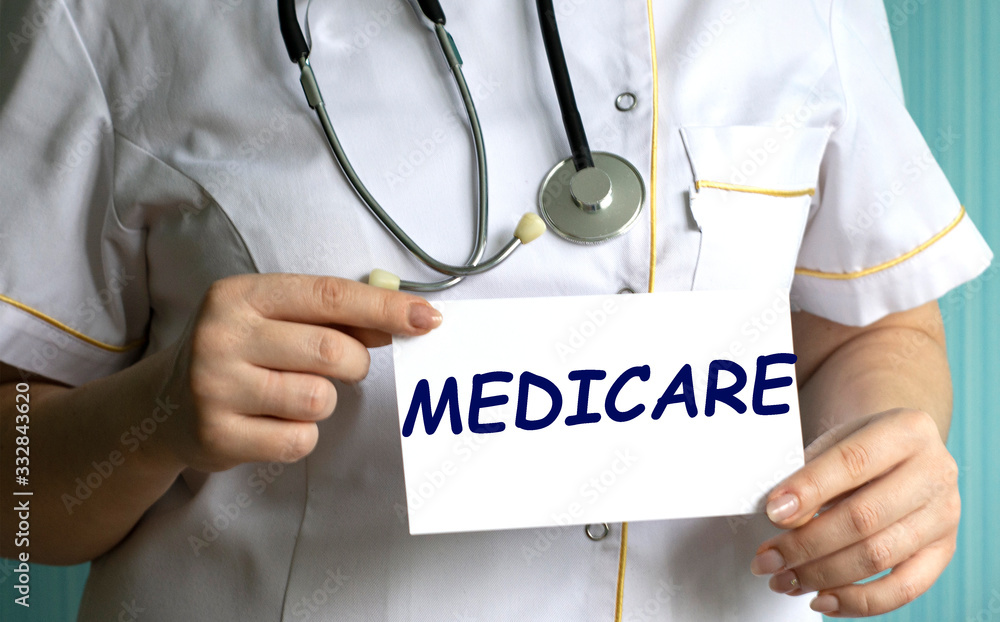 concept word MEDICARE in the hands of a doctor