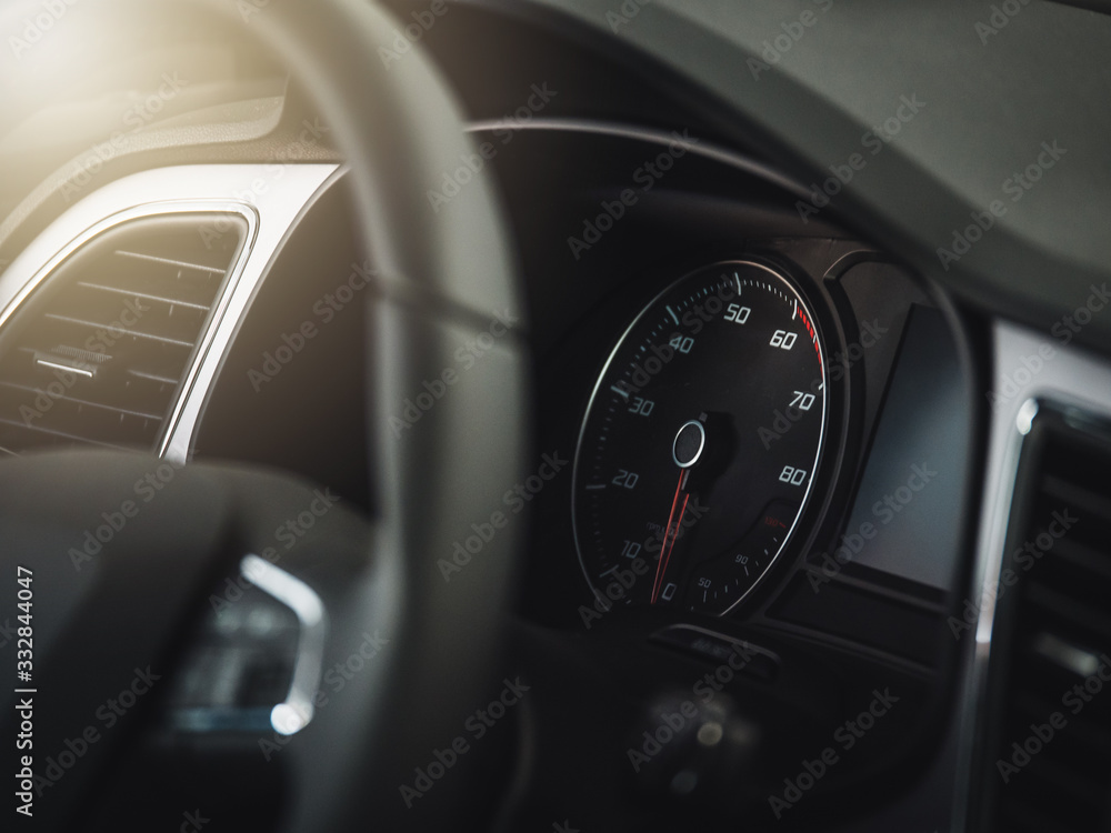 The sign and symbol on car dashboard. Car speedometer closeup. Car interior.