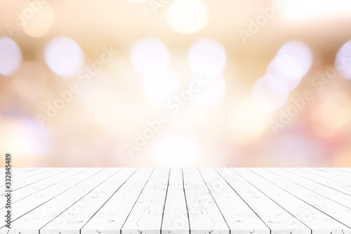 Perspective white wooden table on top over blur natural background, can be used mock up for montage products display or design layout. photo