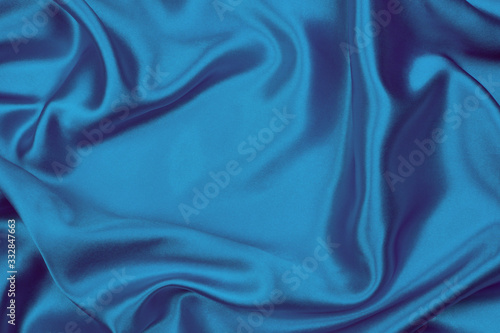 Smooth elegant blue silk or satin texture can use as abstract background, fabric