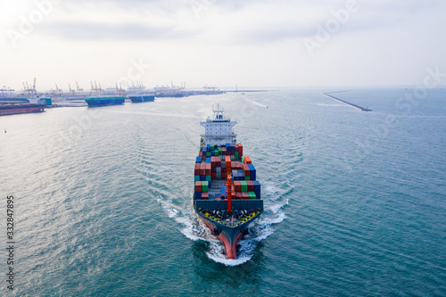 Aerial top view container ship. Business logistic transportation sea freight,Cargo ship, Cargo container in factory harbor at industrial estate for import export around in the world, Trade Port 