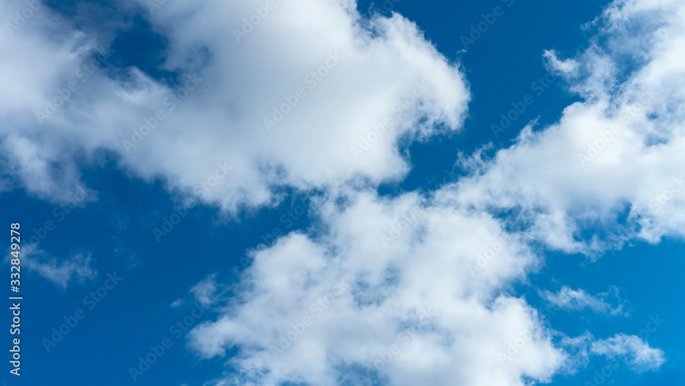 Fototapeta premium a group of white cumulus clouds in the blue sky as a natural background