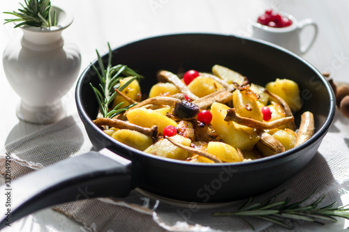delicious fried potatoes with mushrooms, onions and cranberries