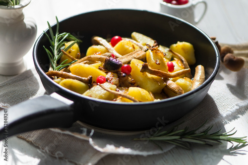 delicious fried potatoes with mushrooms, onions and cranberries