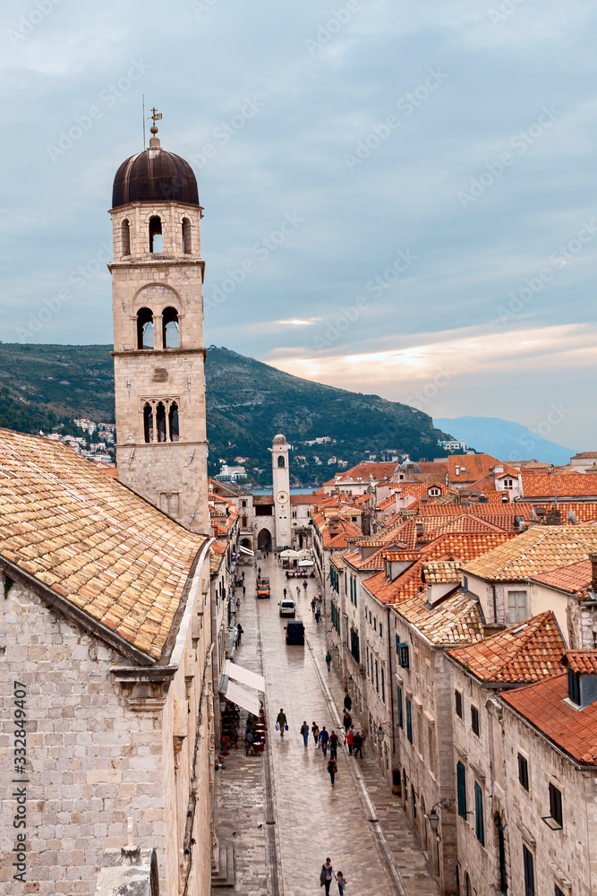 top view of the red tiled roofs and the main street of the ancient Croatian city of Dubrovnik