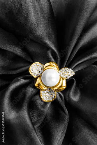 Brooch on black satin