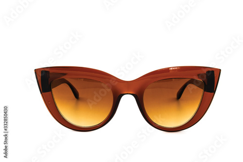 Brown cat eye sunglasses with thick frame and gradient glass isolated on white background, front view.