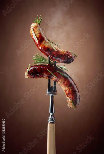 Cuadro en lienzo Grilled Bavarian sausages with rosemary.