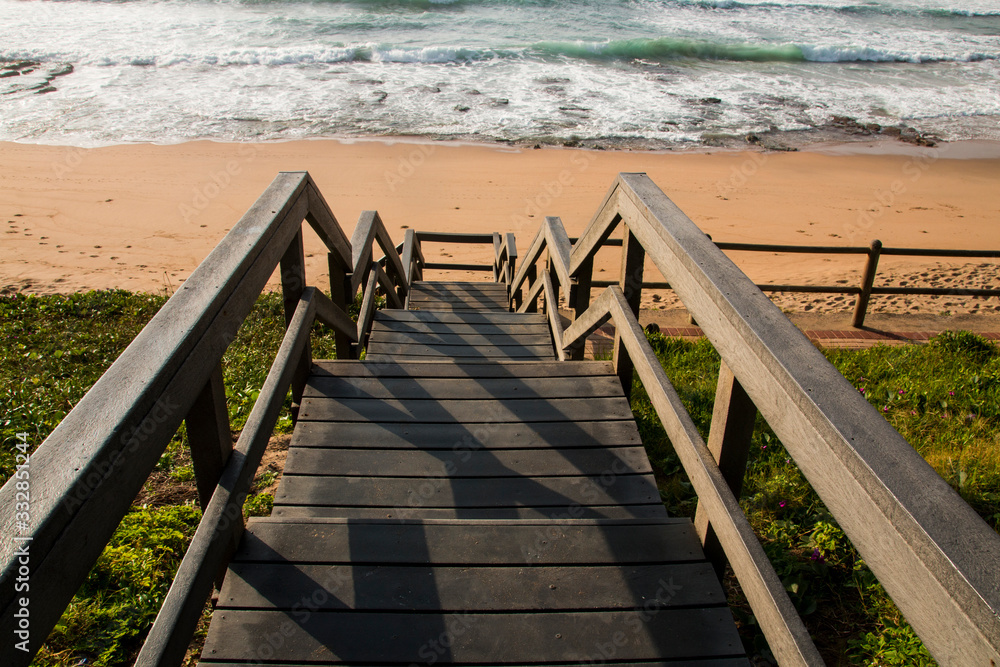 Wood Stairway above Vegetation Leading onto Beach Wood Stairway above Vegetation Leading onto Beach