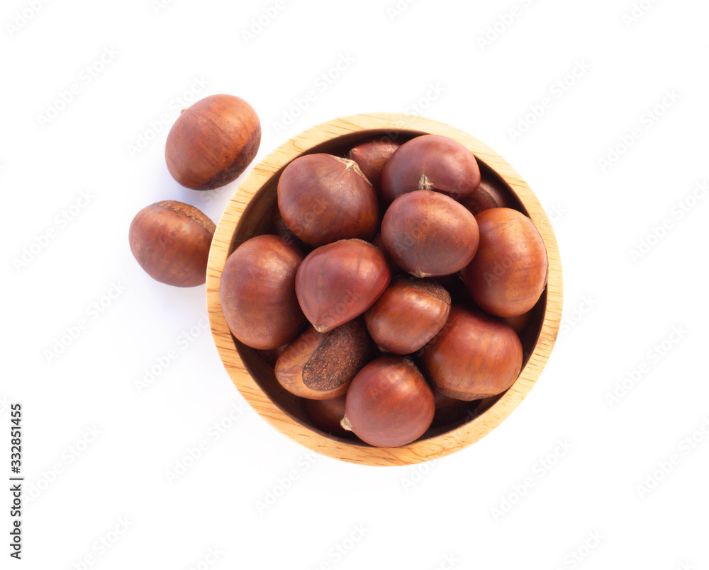 Closeup horse chestnuts in wood bowl isolated on white background, healthy food concept Closeup horse chestnuts in wood bowl isolated on white background, healthy food concept