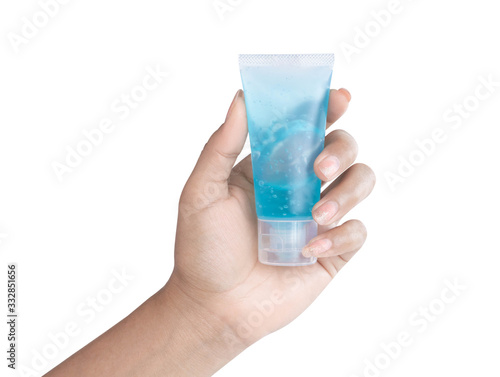 Woman hand holdding alcohol gel in plastic tube for washing hand, health care and medical concept