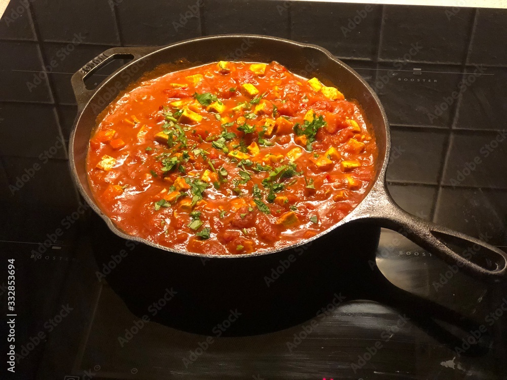 Vegan Indian tofu and tomato stew with chili and turmeric Vegan Indian tofu and tomato stew with chili and turmeric