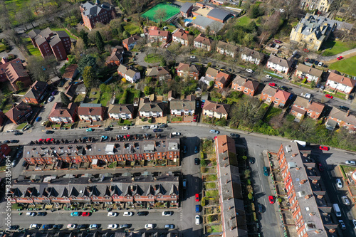 Aerial photo over looking the area of Leeds known as Headingley in West Yorkshire UK, showing a typical British hosing estates and roads taken with a drone on a sunny day photo