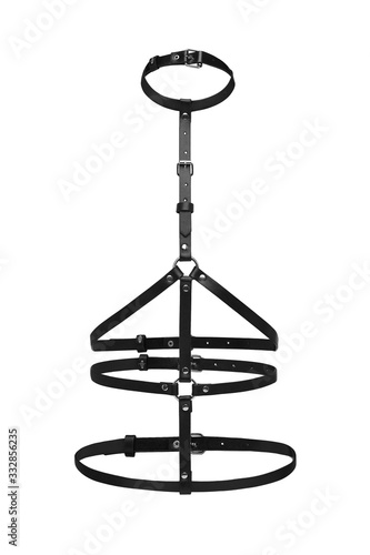 Subject shot of a simple black leather harness made of multirow straps with rivets, steel rings and buckles. The chest harness is isolated on the white background.   photo