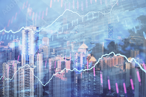 Forex chart on cityscape with skyscrapers wallpaper double exposure. Financial research concept.