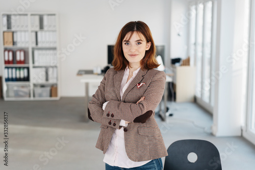 Smart confident businesswoman staring at camera