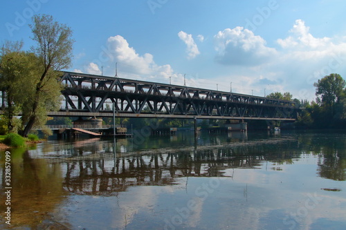 iron train old bridge over the river in sesto calende village in italy 