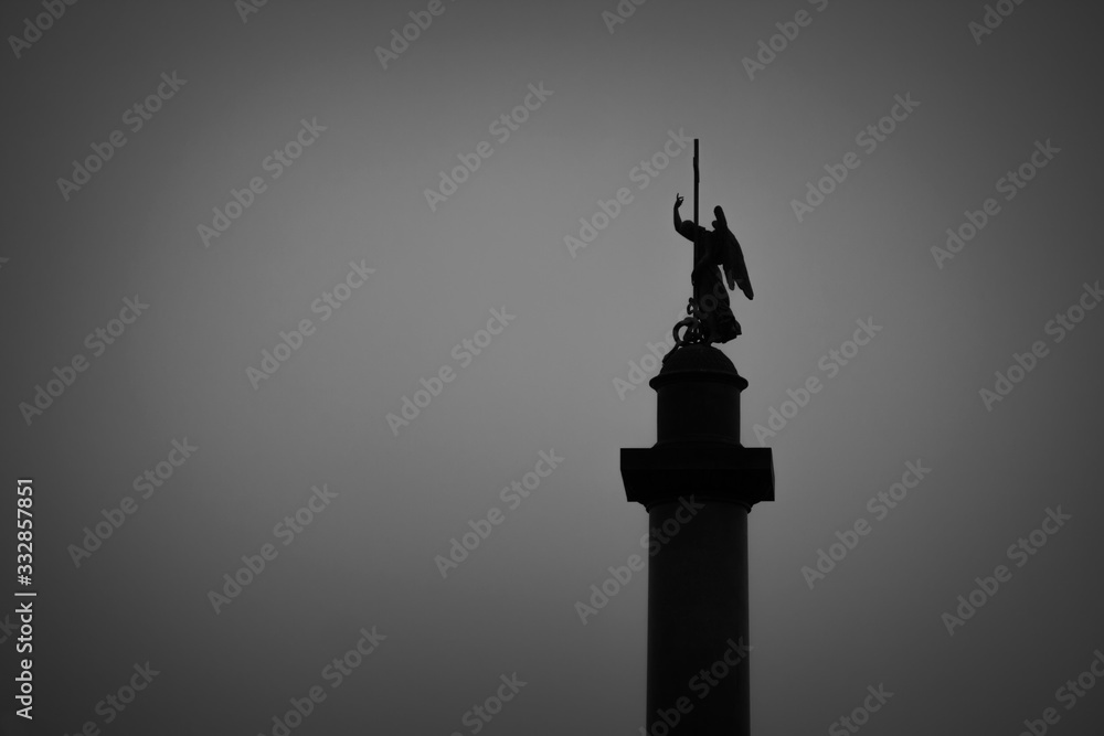 Fototapeta premium Dark silhouette of a statue against the sky