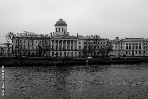 Historic building across the river against the sky