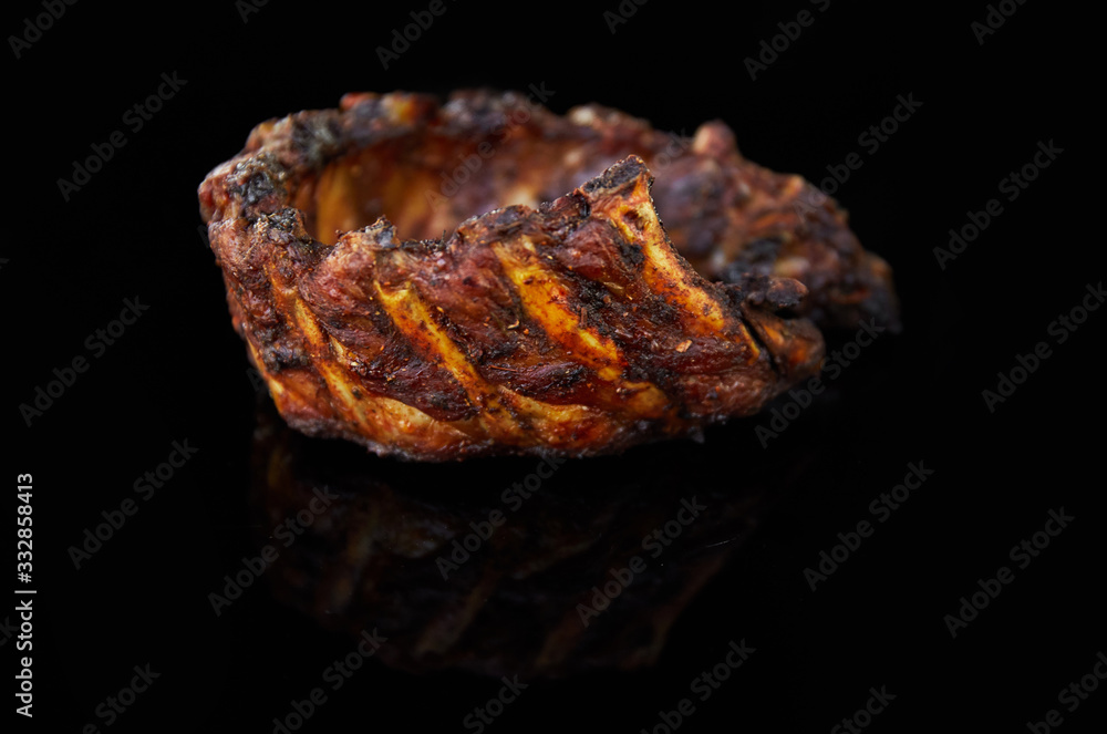 meat ribs on black background