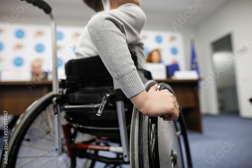 Fotografie Details of an ill disabled young boy in a wheelchair.