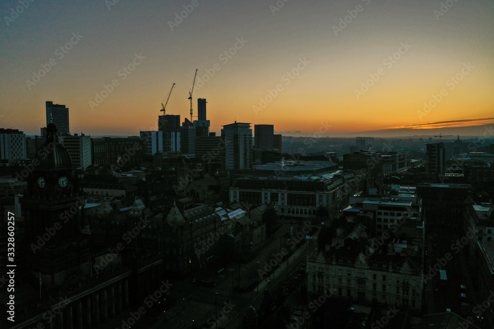 Obraz premium Aerial photo of a beautiful sunrise rising over the town of Leeds in West Yorkshire UK.