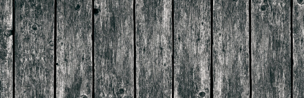 Vertical black and white old boards. Background. Texture. Panorama. Banner. Vertical black and white old boards. Background. Texture. Panorama. Banner.