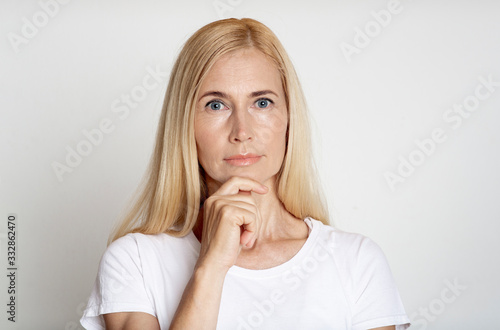 Close up of pensive middle aged woman