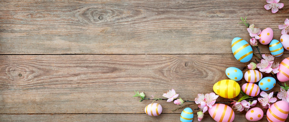  Gift card with colorful easter eggs on old wooden table.