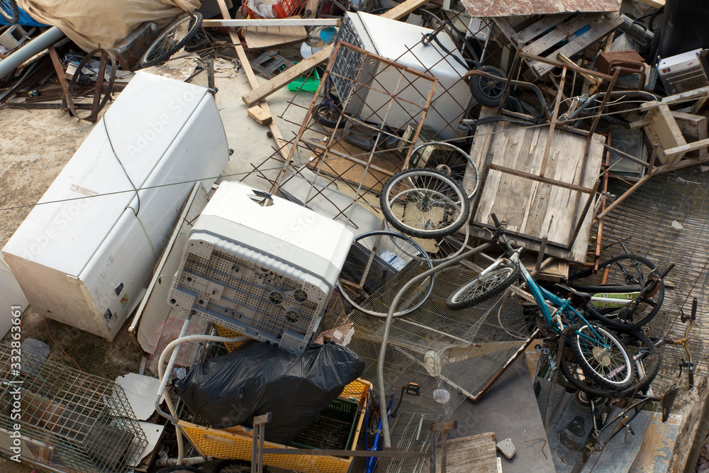 A landfill for various unnecessary things and waste on the roof of one of the houses in Jerusalem