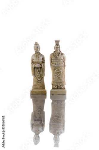 White vintage king and queen chess isolated on white background with reflection on the floor
