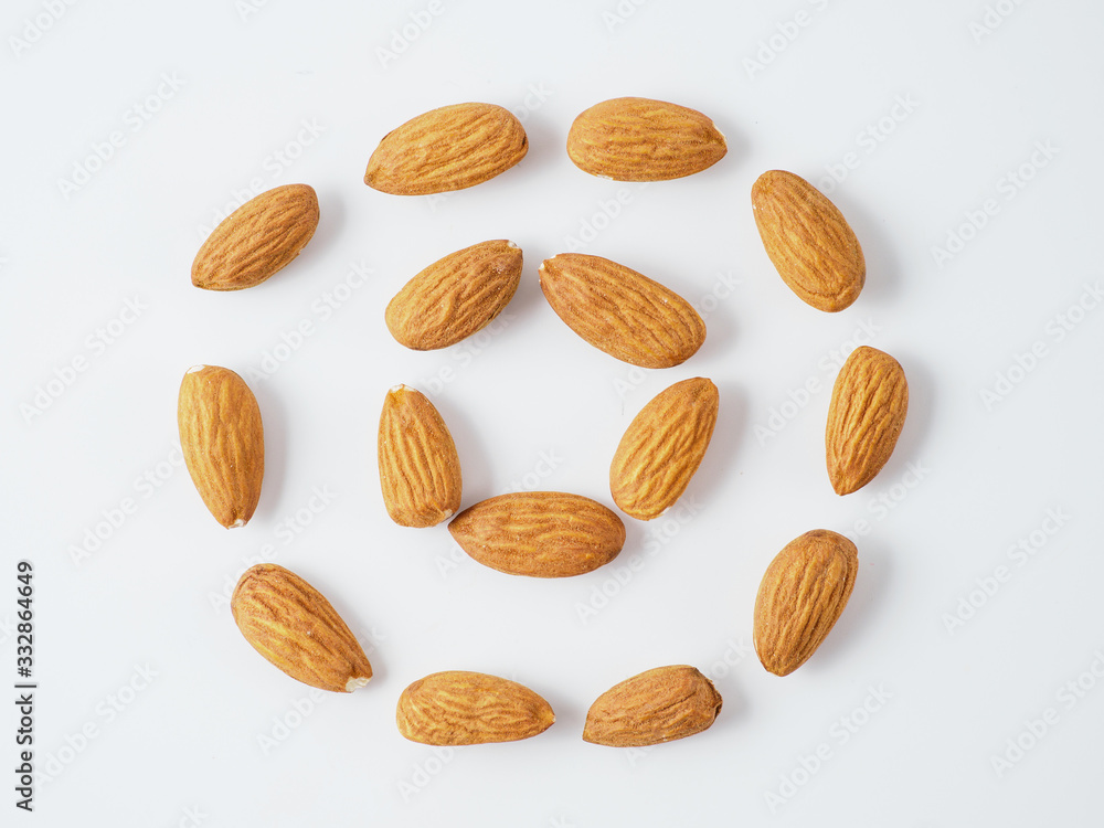 Almond nuts in circle isolated on white background. Almond nuts in circle isolated on white background.