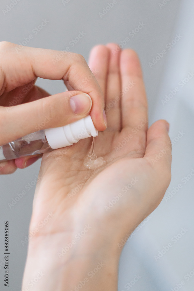 Application of antibacterial agent - antiseptic - with aloe vera gel, alcohol and essential oils on hands. Close up. Skin care serum. Natural leaving. Virus Prevention and treatment.