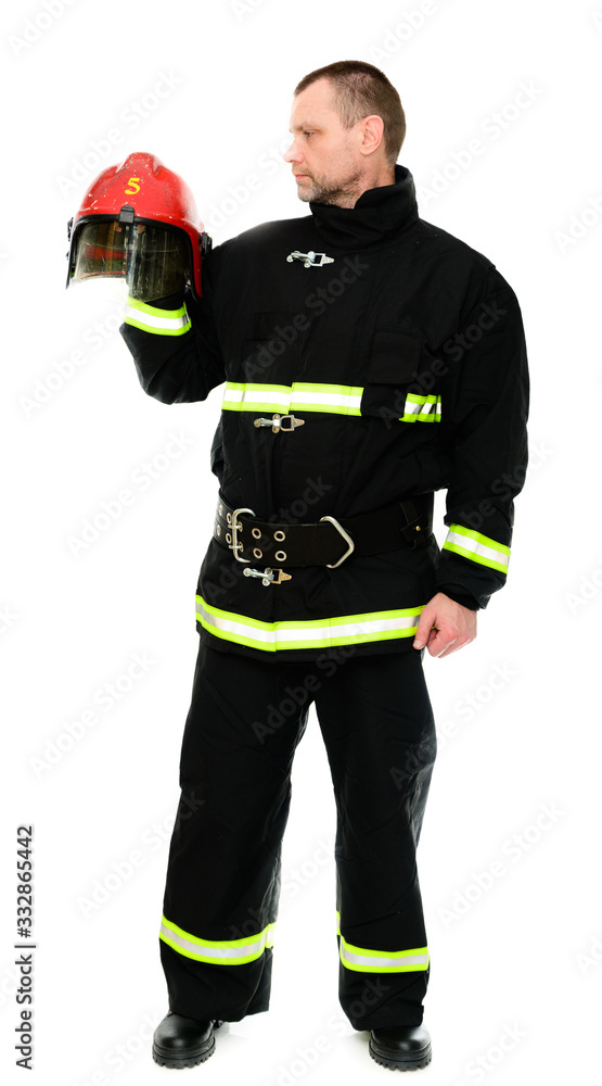 Vertical Isolated Photo of a Firefighter in uniform with a red helmet in his hands Vertical Isolated Photo of a Firefighter in uniform with a red helmet in his hands