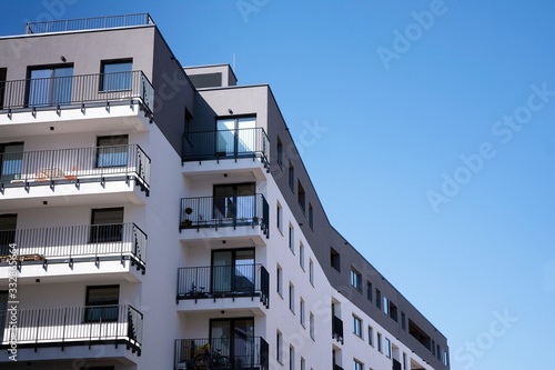 Modern european apartment building with balconies on a clear sunny day