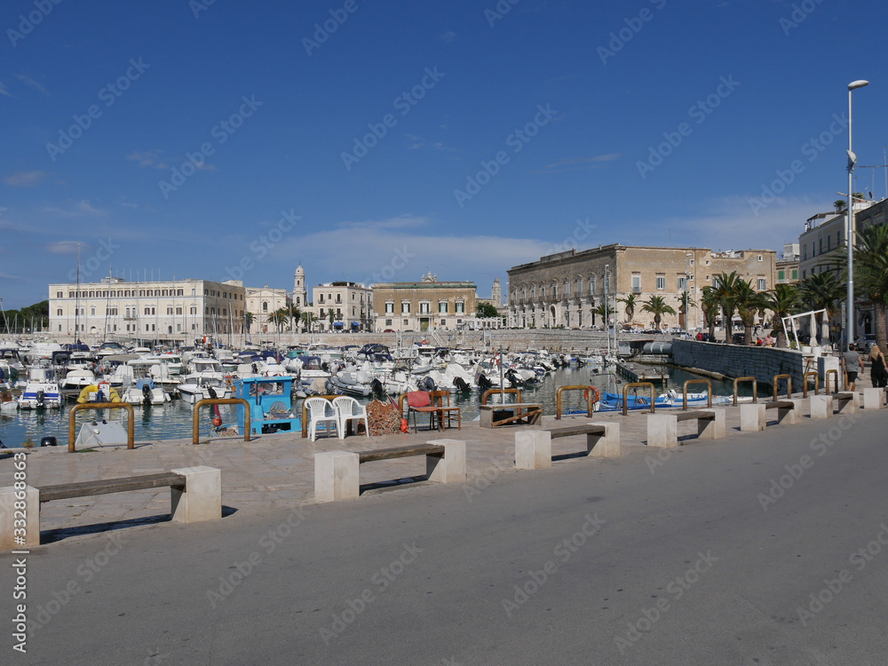 Trani – panorama of the Port closed by historic buildings built by the white local stone