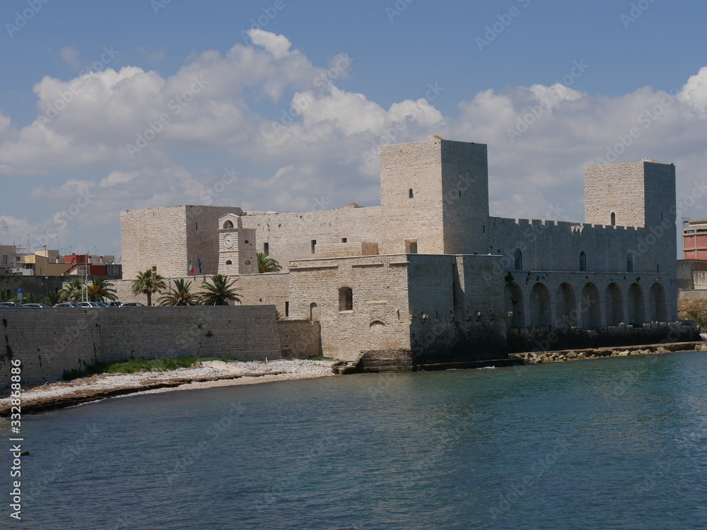 Trani – Swabian Castle of Trani with a quadrangular shape with square towers at the corners and surrounded by fortifications and a moat on the side of the land and by the sea on the other