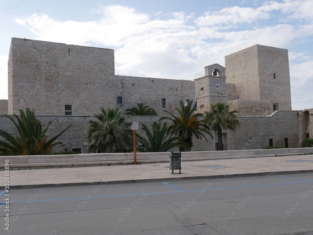 Trani – Swabian Castle of Trani with a quadrangular shape with square towers at the corners and surrounded by fortifications and a moat on the side of the land and by the sea on the other