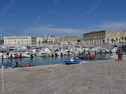 Trani – panorama of the Port closed by historic buildings built by the white local stone