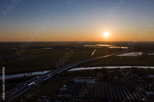 A viaduct bridge crossover a canal of highway A59 during sunrise near Waalwijk, Noord Brabant, Netherlands