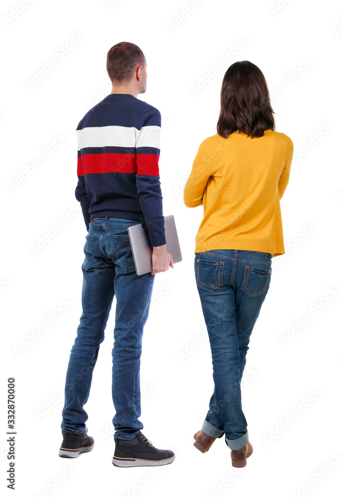 Back view couple with laptop in sweater. Back view couple with laptop in sweater.