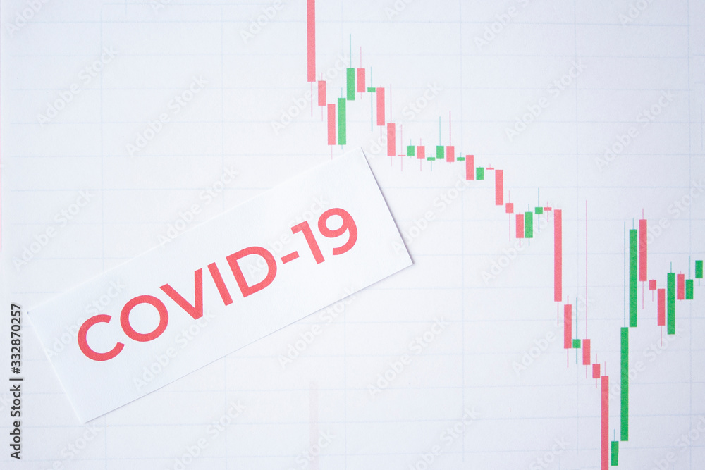 The inscription quote 2019 ncov on a white background with falling down charts and graphs. Economic crisis due to coronavirus. Fall quotes due to outbreaks of infection The inscription quote 2019 ncov on a white background with falling down charts and graphs. Economic crisis due to coronavirus. Fall quotes due to outbreaks of infection