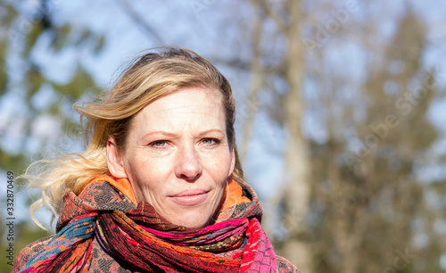 40 years old, portrait of a beautiful woman in close-up outdoors