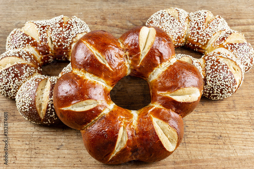 lye kringle with sesame on a wooden board photo