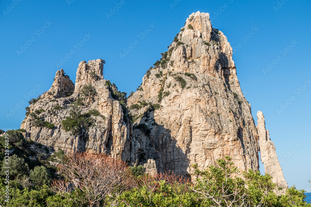 Fototapeta premium high red limestone pyramid in Baunei