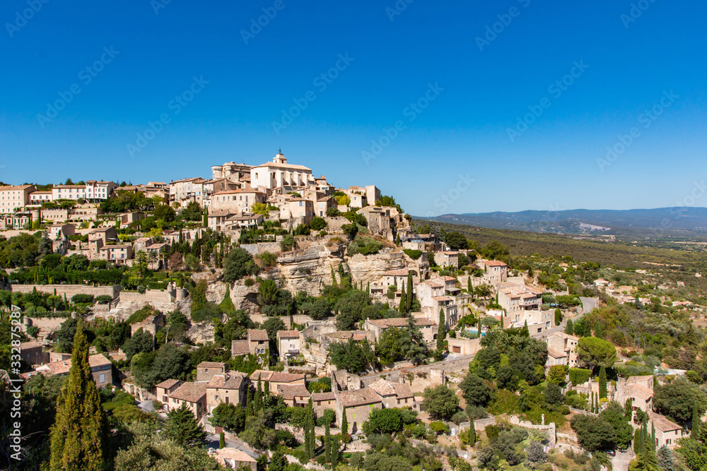 View of Gordes, a small medieval town in Provence, France. A view of the ledges of the roof of this beautiful village and landscape.