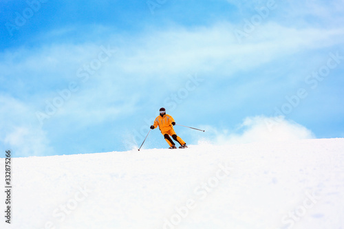 a man with ski equipment on the top of the mountain  photo