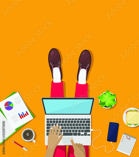 Home office. Man seating on the floor with laptop working