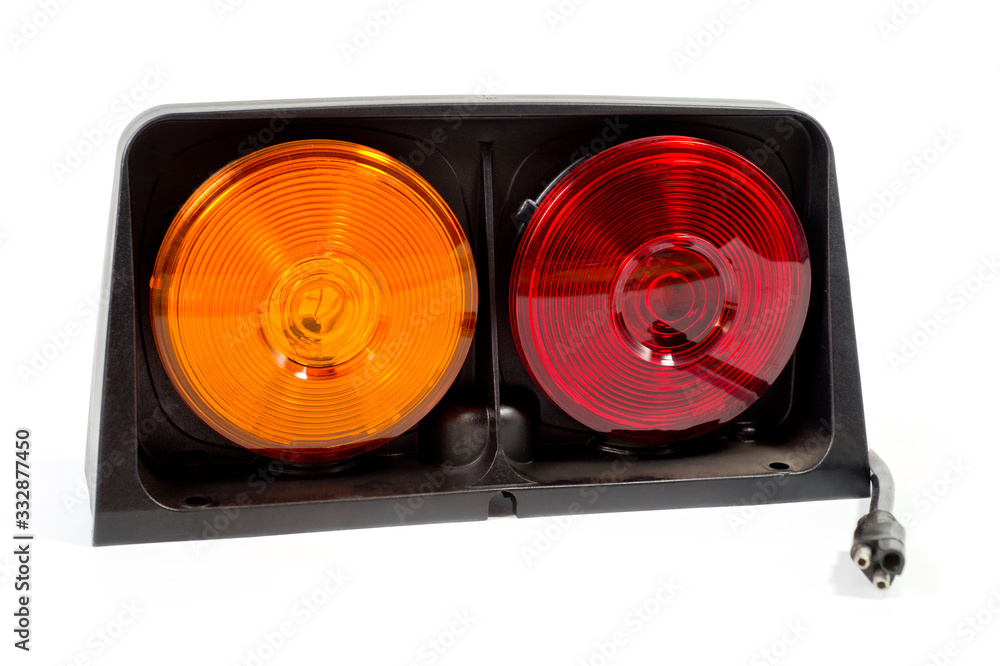 Double stop and turn signal designed for installation on agricultural machinery, trucks and trailers. Background for automotive electronics and light signals.